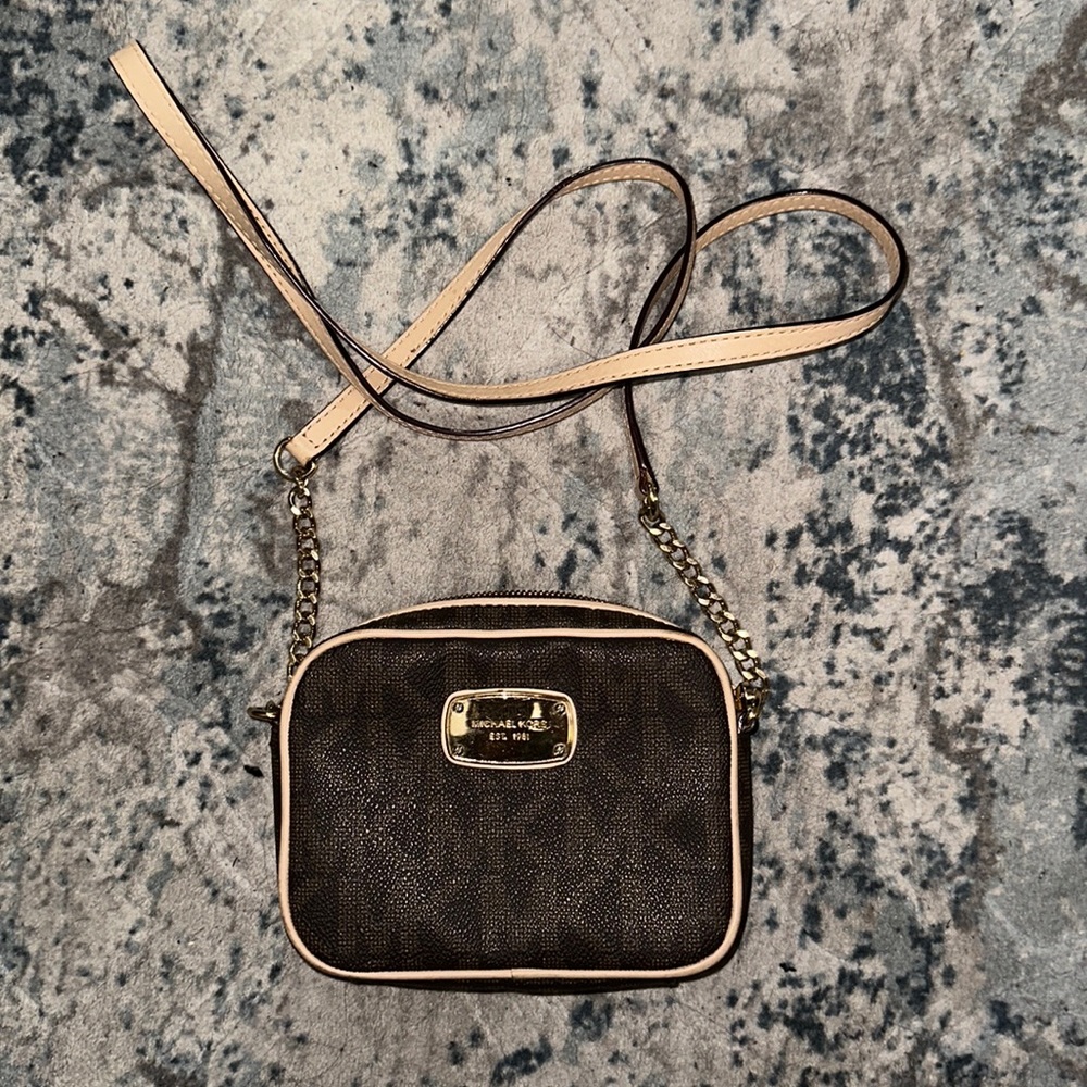 Michael Kors mini monogram crossbody bag.